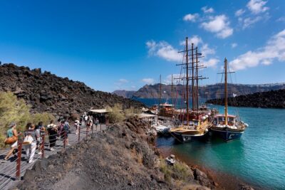 Santorini - Volcano and Hot springs Boat Trip with Bus Transfer - Volcano stop at Erinia: active craters, sulfur smell, and an uphill choice
